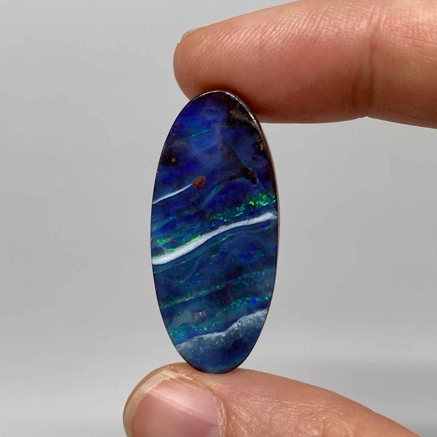 25.78 Ct long oval boulder opal
