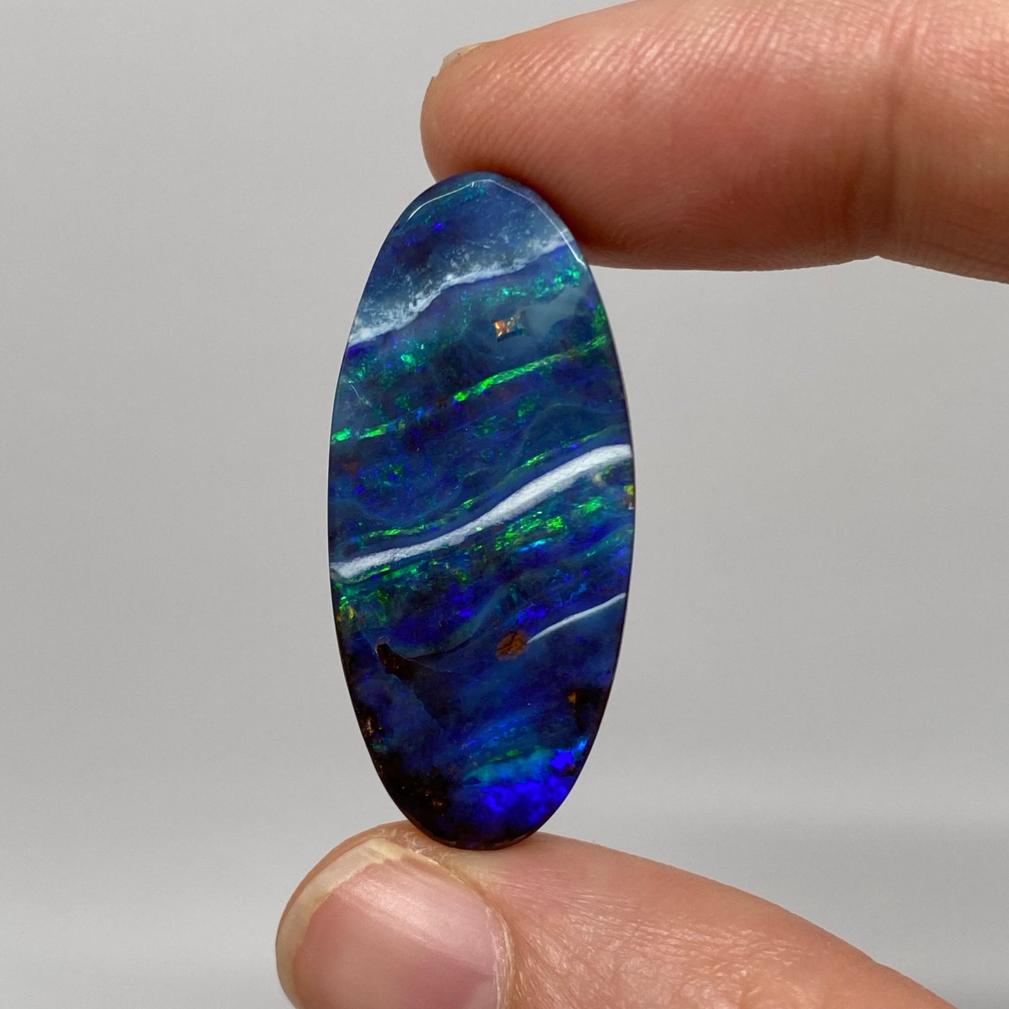 25.78 Ct long oval boulder opal